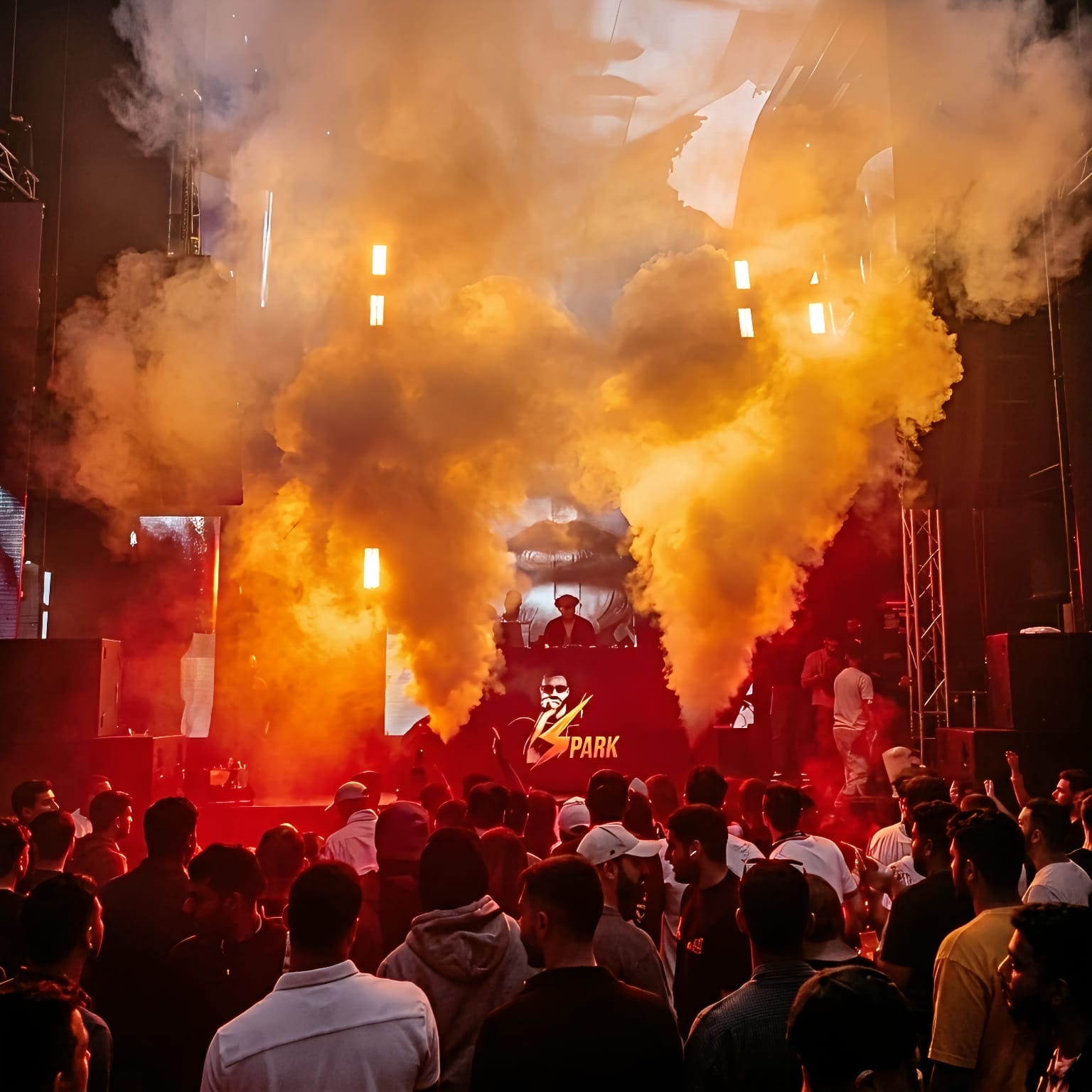 Confetti falling over a packed nightclub crowd during a celebration