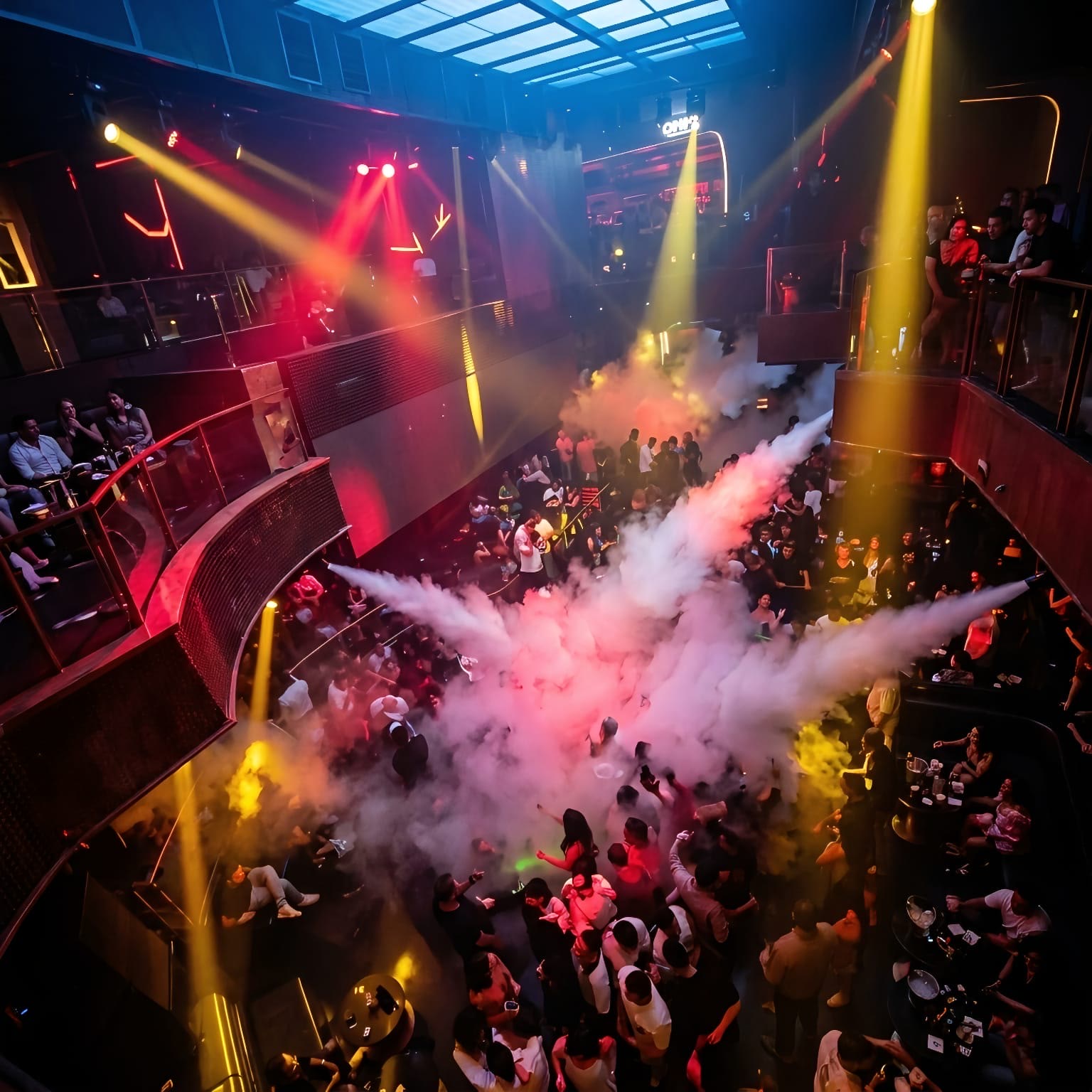 Packed nightclub dance floor during a peak-hour CO2 show